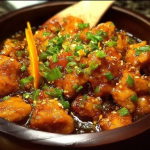 Asian Crockpot Orange Chicken Asian Crockpot Orange Chicken served on a plate with garnishes