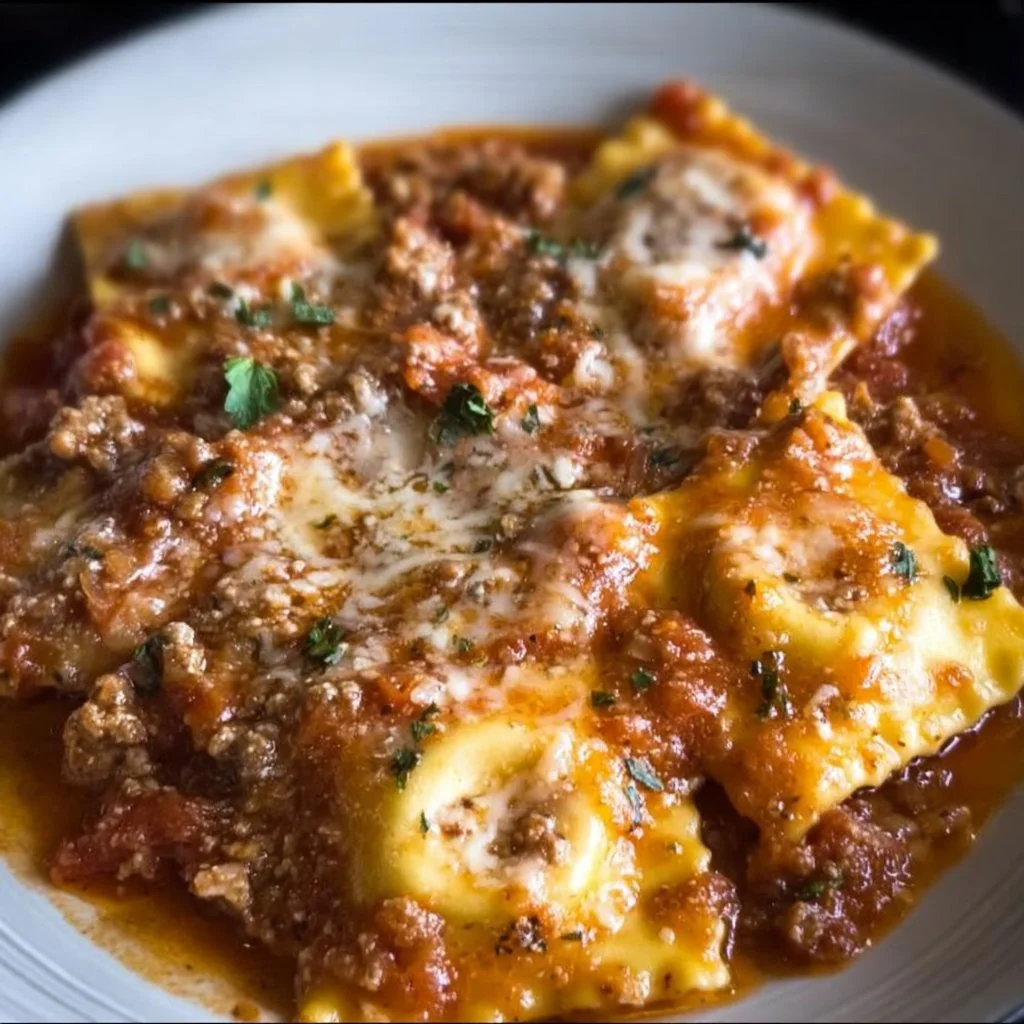 Delicious Crockpot Ravioli Lasagna served on a plate with melted cheese