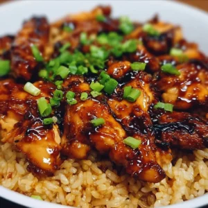 Honey BBQ Chicken Rice Delicious Honey BBQ Chicken served over rice with vibrant garnishes.