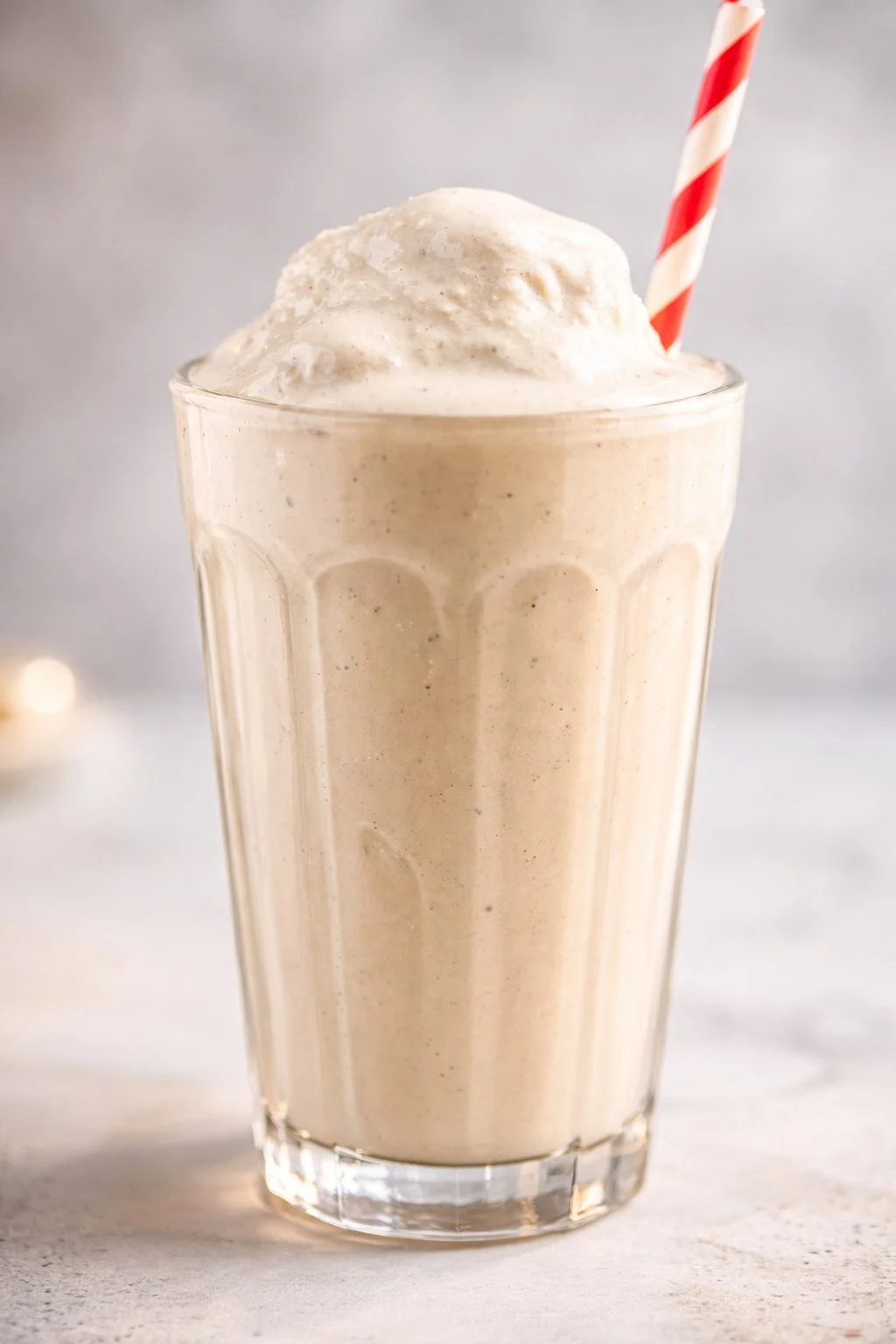 Creamy and delicious basic vanilla milkshake in a glass