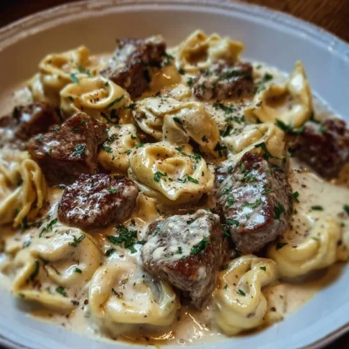 Cracked Garlic Steak Tortellini in Creamhouse Sauce Bliss Delicious Cracked Garlic Steak Tortellini in Creamhouse Sauce served in a bowl