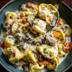 Crock Pot Cheesesteak Tortellini Delicious Crock Pot Cheesesteak Tortellini served in a bowl