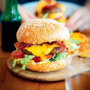 Delicious Hamburger Classic with cheese served on a bun with fresh toppings