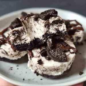 Healthy no-bake Oreo cheesecake bites topped with crushed Oreos.