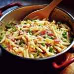 One-Pot Pasta with Peas and Bacon in a skillet