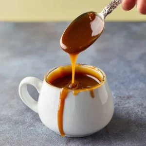 Homemade salted caramel sauce drizzled over dessert
