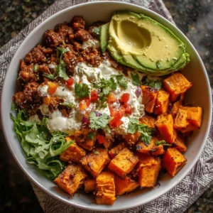 Healthy sweet potato taco bowl with colorful toppings