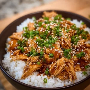 Asian Crock Pot Teriyaki Chicken served on a plate with rice and vegetables.