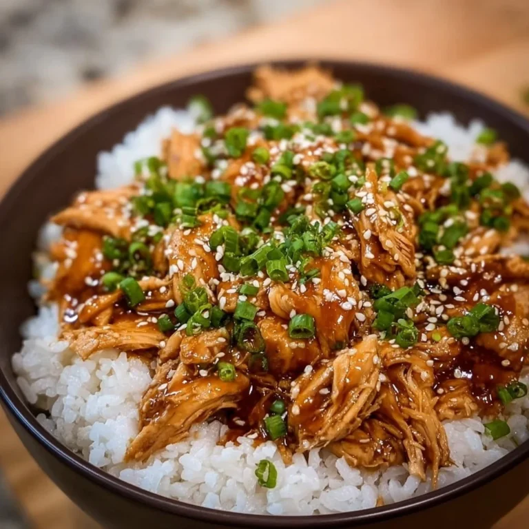 Asian Crock Pot Teriyaki Chicken served on a plate with rice and vegetables.
