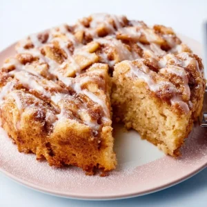 Deliciously baked Best Cinnamon Apple Cake with spiced apples and frosting