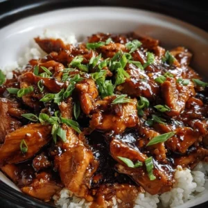 Crockpot Bourbon Chicken served with vegetables on a plate
