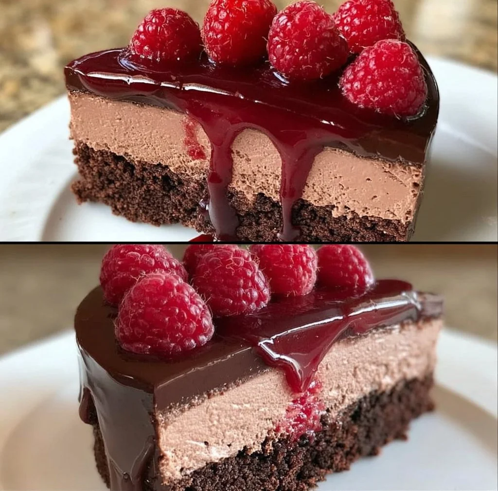 Home Dark Chocolate Raspberry Mousse Cake topped with fresh raspberries and chocolate shavings.