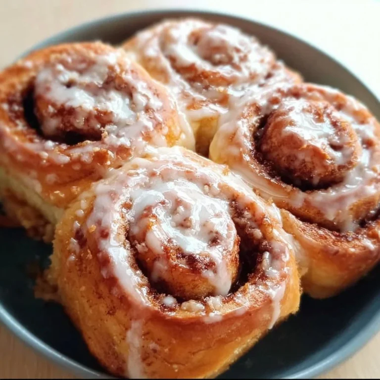 Delicious homemade cinnamon rolls served warm on a plate