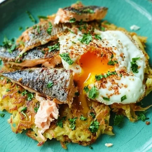 Herby Hash Browns served with eggs and mackerel on a plate