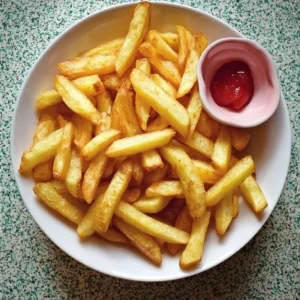 Homemade Chips or Fries Freshly made homemade chips and fries served in a bowl.