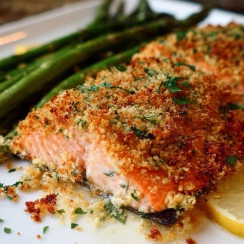 Delicious panko crusted salmon fillet garnished with herbs