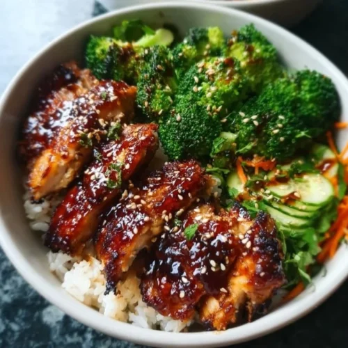 Sticky Chicken Bowls with colorful vegetables and rice in a bowl
