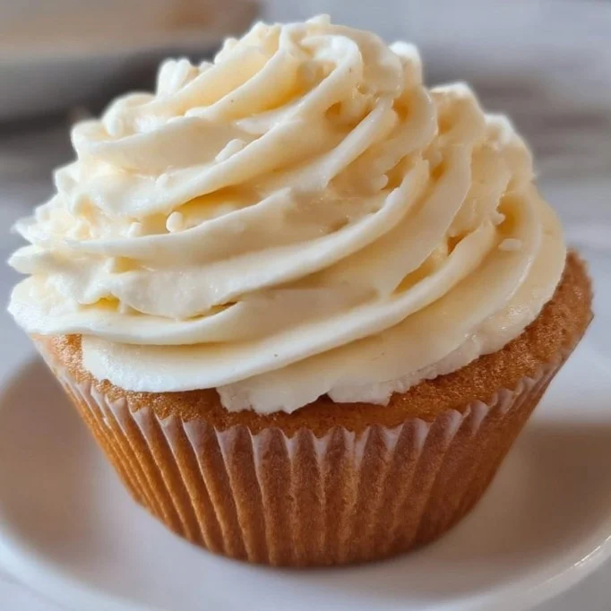 Delicious vanilla buttercream frosting spread on a cake