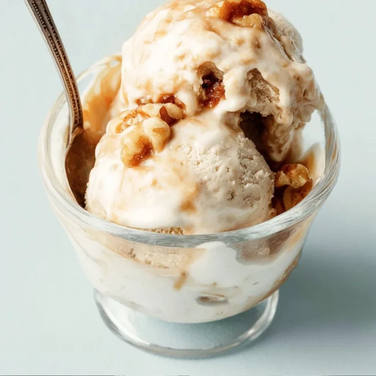 Bowl of browned butter caramel walnut ice cream topped with nuts