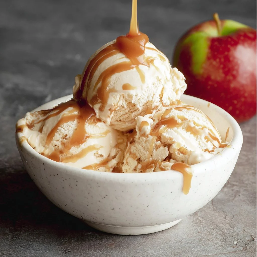Delicious caramel apple swirl ice cream in a bowl with caramel drizzle