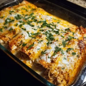 High protein chicken enchiladas served on a plate with toppings.