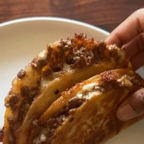 Delicious crispy ground beef tacos topped with fresh ingredients