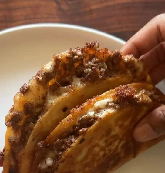 Delicious crispy ground beef tacos topped with fresh ingredients