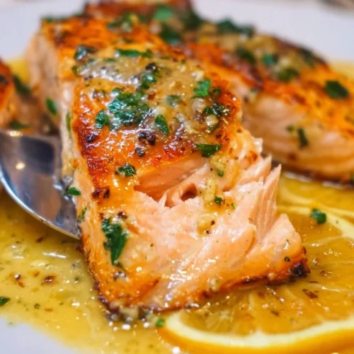 Easy Lemon Garlic Salmon Delicious lemon garlic salmon served with herbs and vegetables