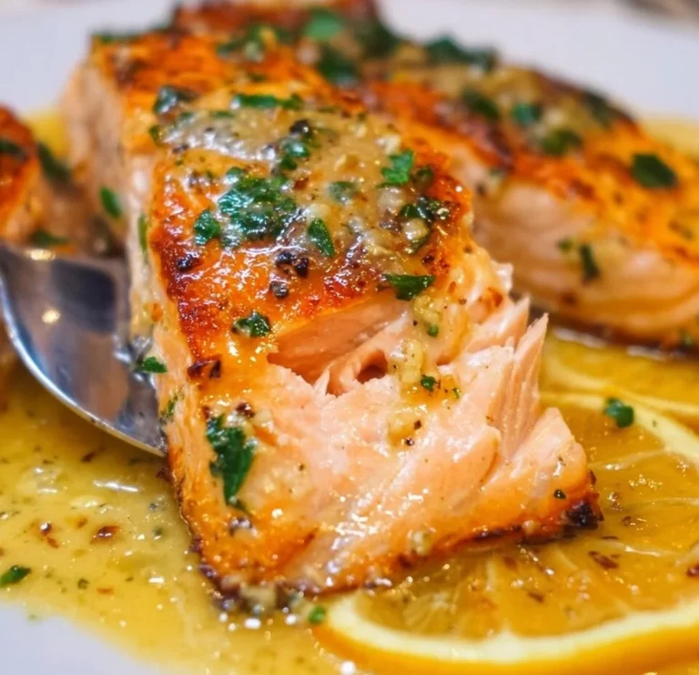 Delicious lemon garlic salmon served with herbs and vegetables