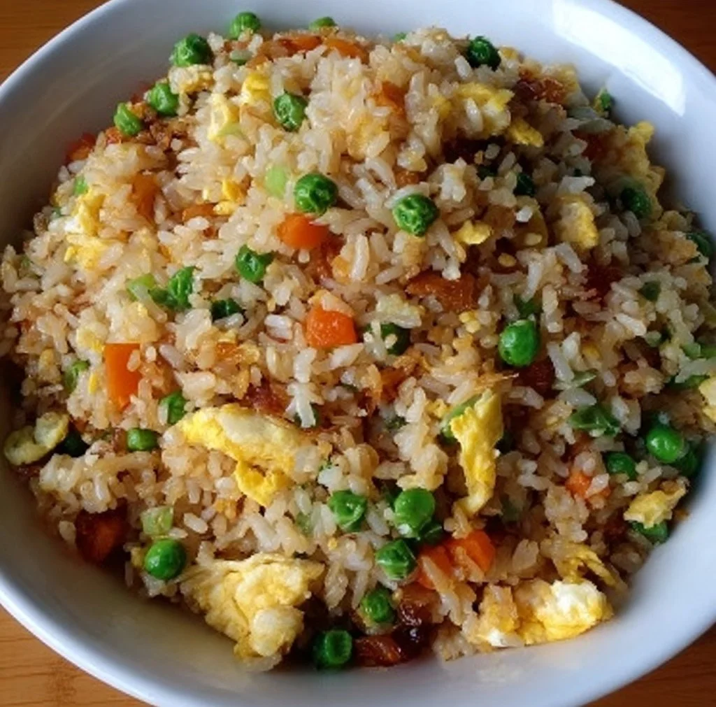 Delicious homemade fried rice served with vegetables and herbs.