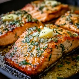 Garlic Butter Baked Salmon Delicious garlic butter baked salmon garnished with herbs