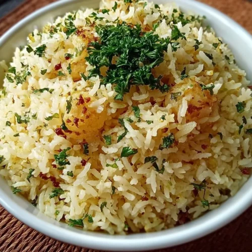 Garlic Butter Rice Delicious serving of Garlic Butter Rice with herbs and spices