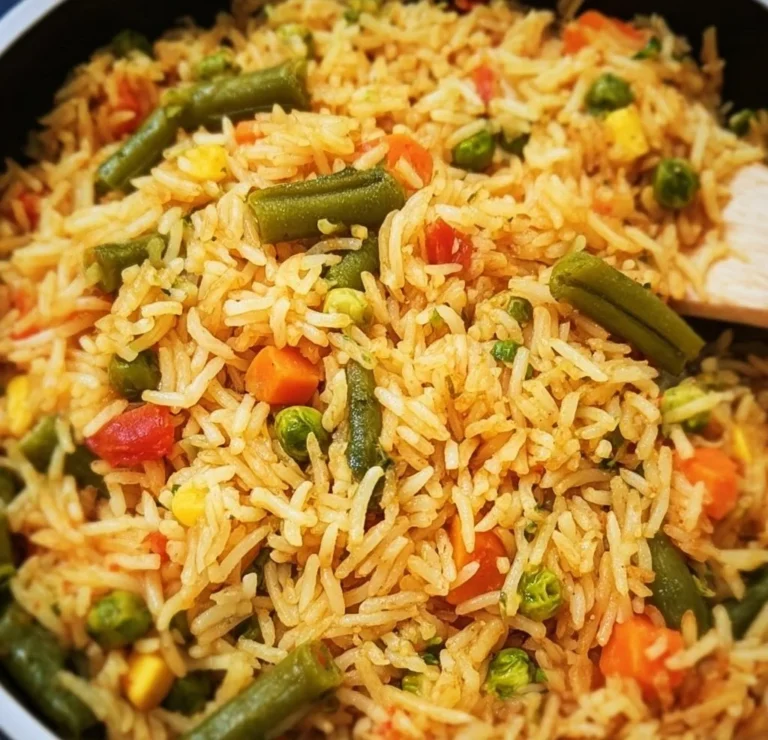 Bowl of colorful Mixed Vegetable Rice garnished with fresh herbs