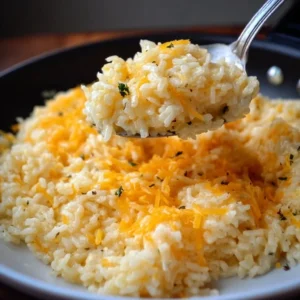 Quick Stovetop Cheesy Rice with Sharp Cheddar and Garlic Stovetop cheesy rice with sharp cheddar and garlic in a bowl