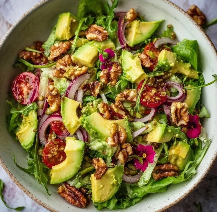 Home Vibrant spring salad featuring avocado and fresh vegetables