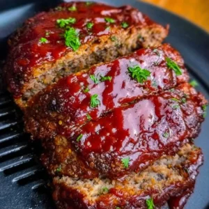 Delicious air fryer meatloaf served with sides in a cozy kitchen.