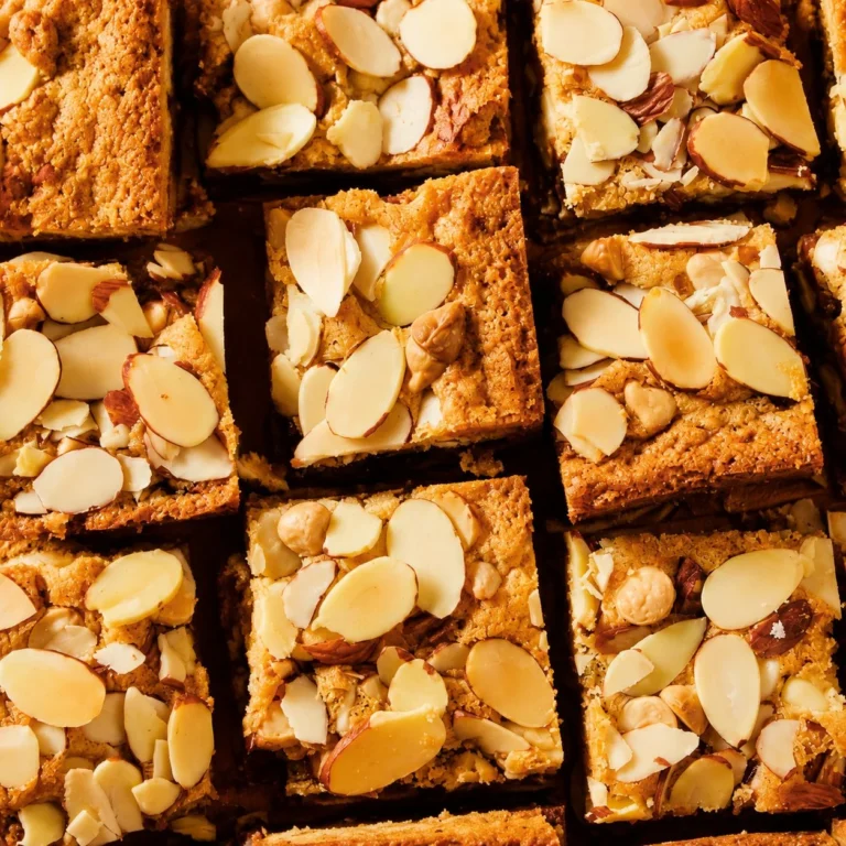 Delicious Cranberry Almond White Chocolate Bars on a wooden plate