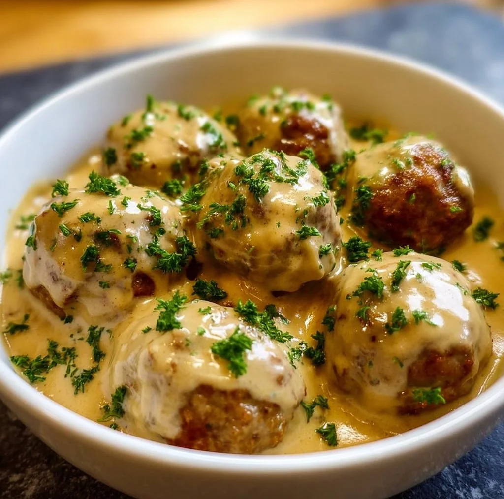 Creamy Swedish meatballs served with sauce over mashed potatoes