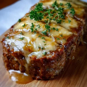 French Onion Meatloaf Deliciously baked French Onion Meatloaf topped with melted cheese and caramelized onions.