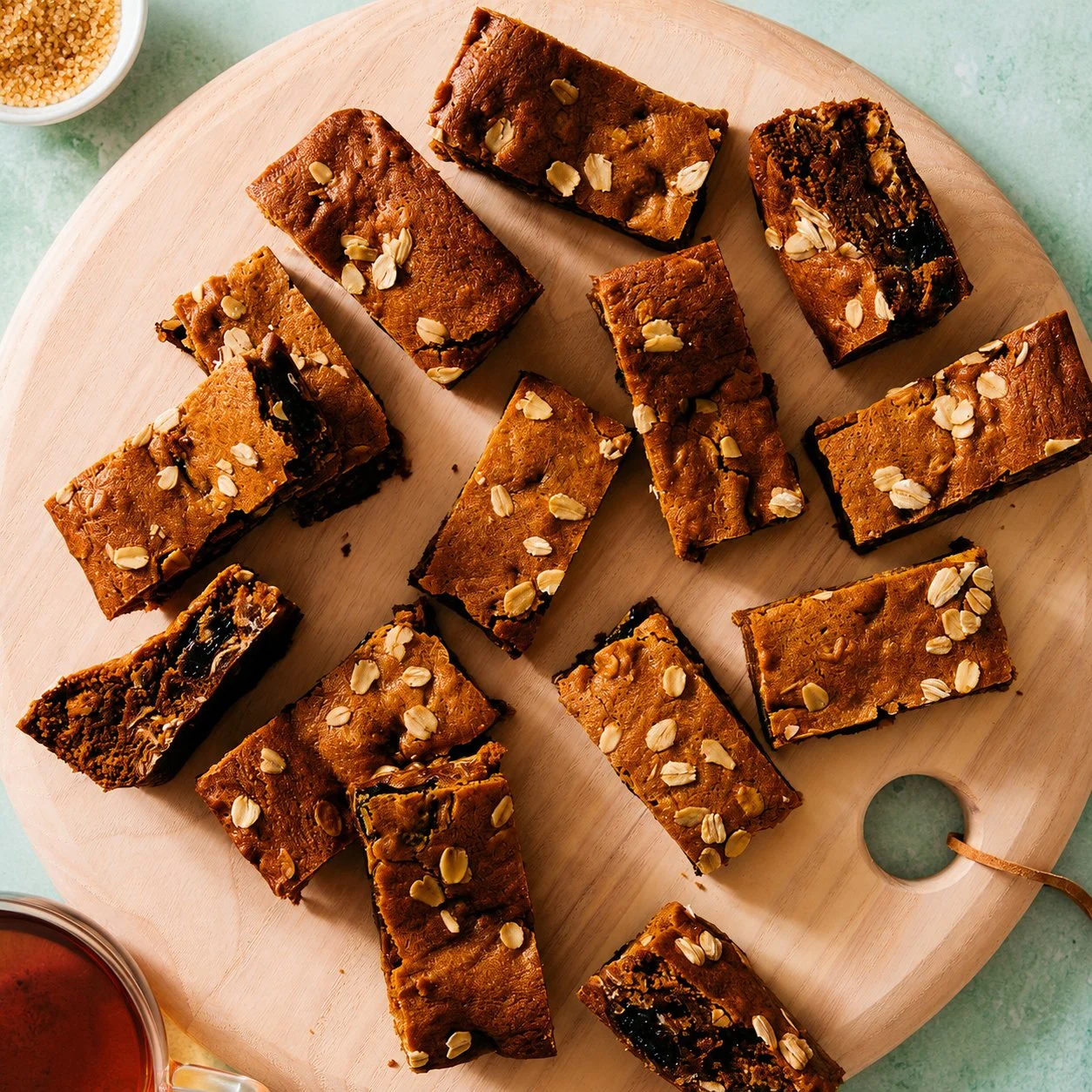 Homemade Ginger Cherry Oatmeal Cookie Bars stacked on a plate