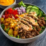 Healthy Burger Bowl with fresh vegetables and grilled meat ingredients