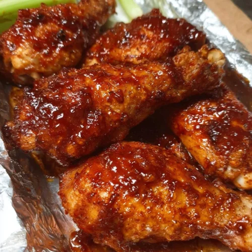 Honey BBQ Baked Chicken served on a plate with garnish