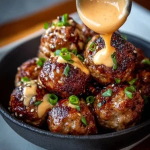 Plate of Korean BBQ Meatballs with a side of spicy mayo dip