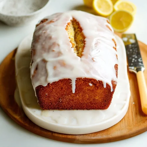 Lemon Almond Poppy Seed Cake with lemon glaze on a decorative plate