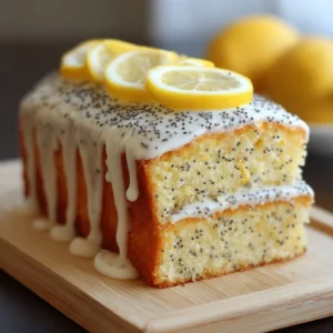 Slice of lemon poppy seed cake with glaze on a plate