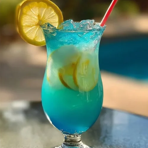 Colorful Mermaid Lemonade in a glass with vibrant hues of blue and pink.