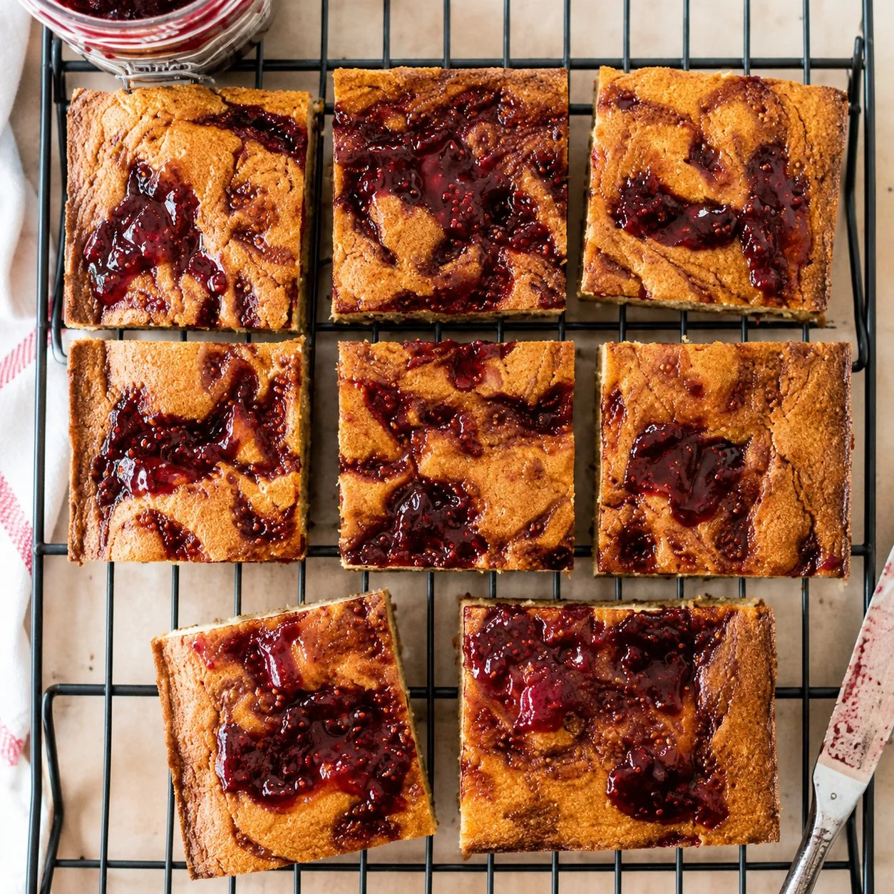 Peanut Butter & Raspberry Swirl Cake with layers of creamy frosting