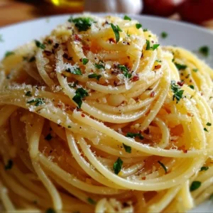 Delicious spaghetti with garlic and oil dish garnished with fresh herbs