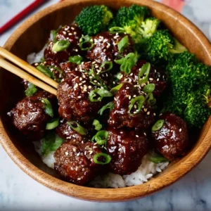 Sticky Mongolian Beef Meatballs served with garnish on a plate